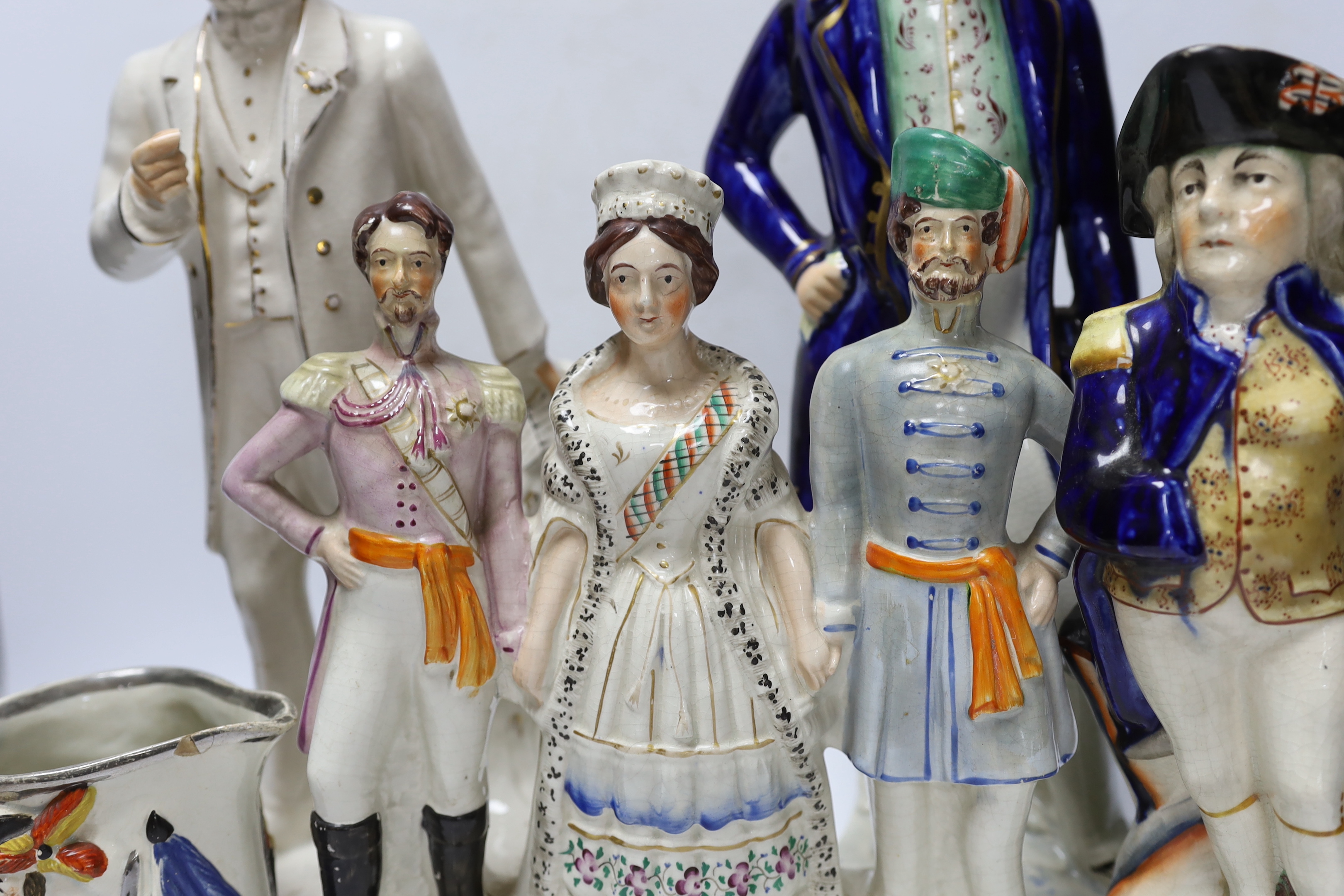 Military and Political Staffordshire figures - A Crimean war group of France, England and Turkey, a figure of Wellington as Prime Minister, a figure of Gladstone, a Nelson Toby jug and a General Hill/Marquis Wellington c